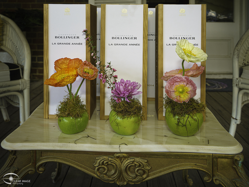Spirit of Madame Bollinger Line of of Grande Annee champagnes with floral displays